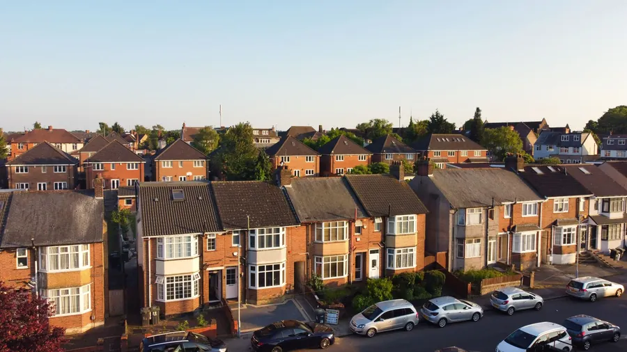Bay-fronted interwar semi-detached houses with long tiled ridge lines, typical of Croydon's suburbs