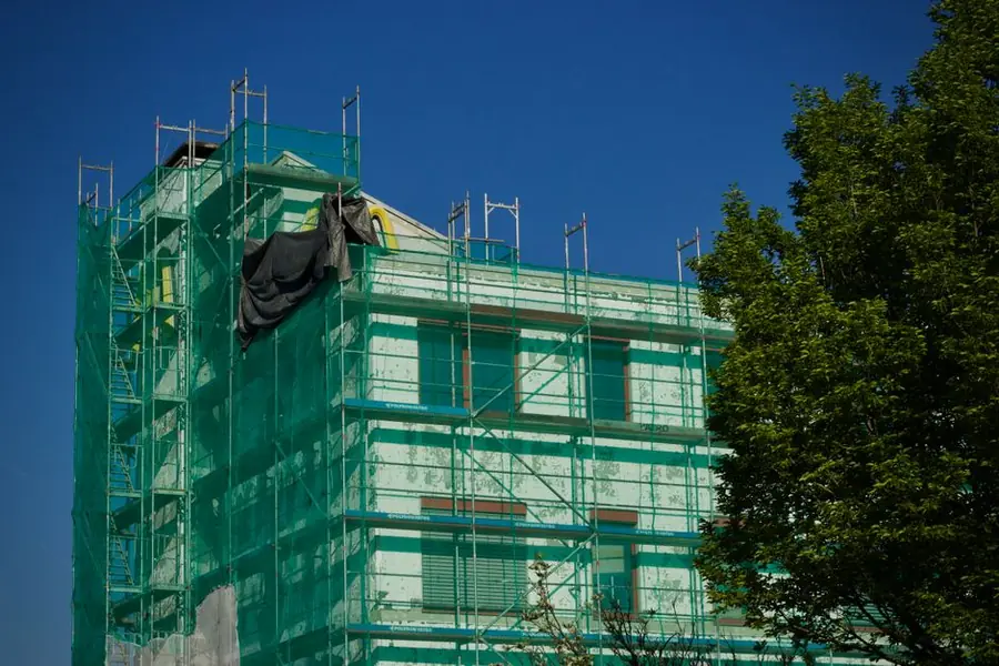 Scaffolding erected on a converted property for shared roof repair work in Croydon