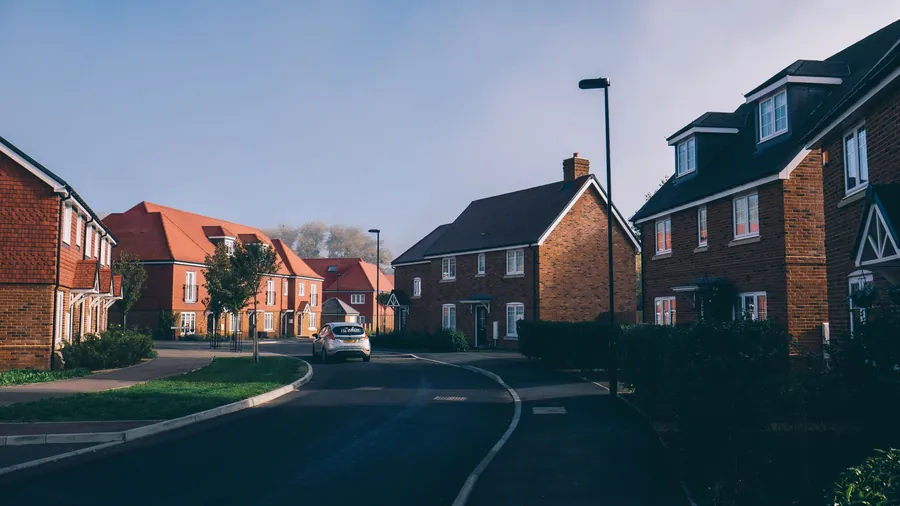 A quiet suburban street of brick houses near Croydon of the kind visited by doorstep roofers after a storm