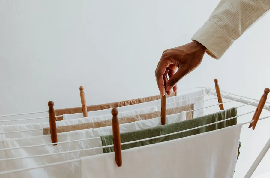 Washing hung out to dry on an indoor airer, one of the everyday sources of moisture that ends up condensing in a cold roof void