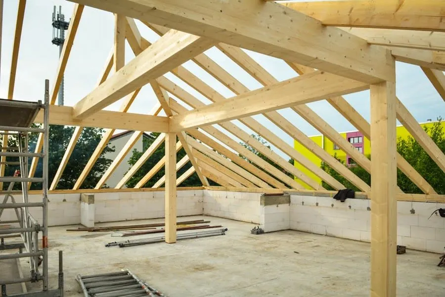 A Croydon roof stripped back to its rafters and battens partway through a full replacement