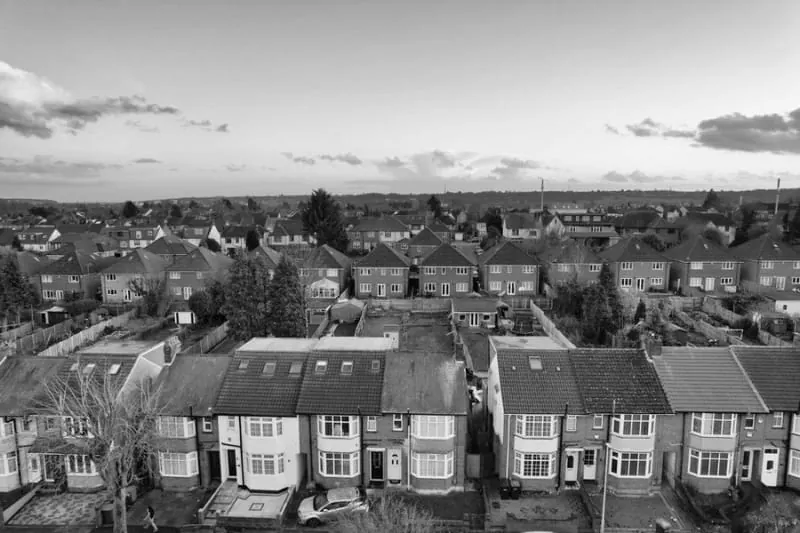 Rows of joined semi-detached and terraced houses in Croydon whose roofs run continuously over the party walls